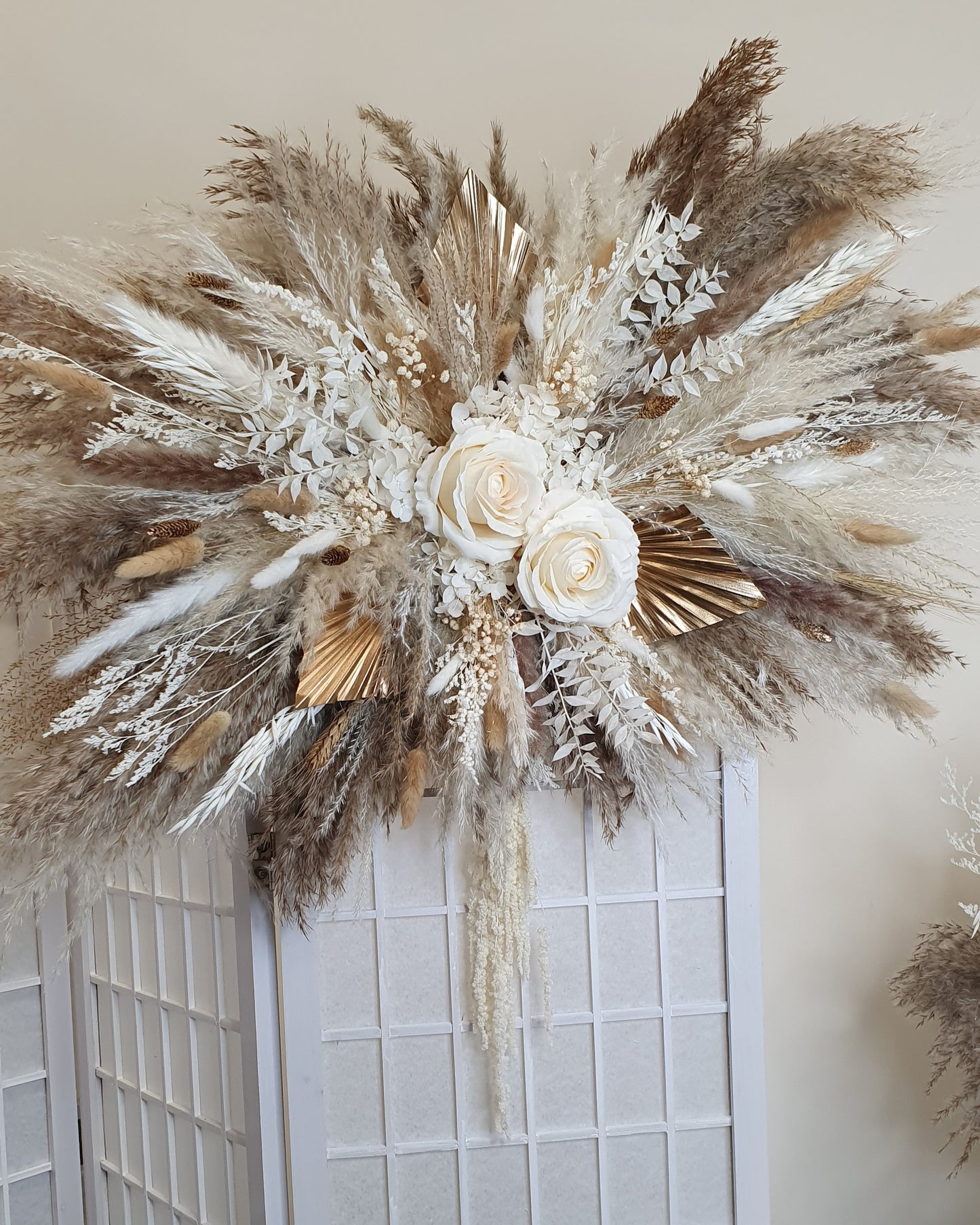 gold and neutral cram pampas wall arrangement