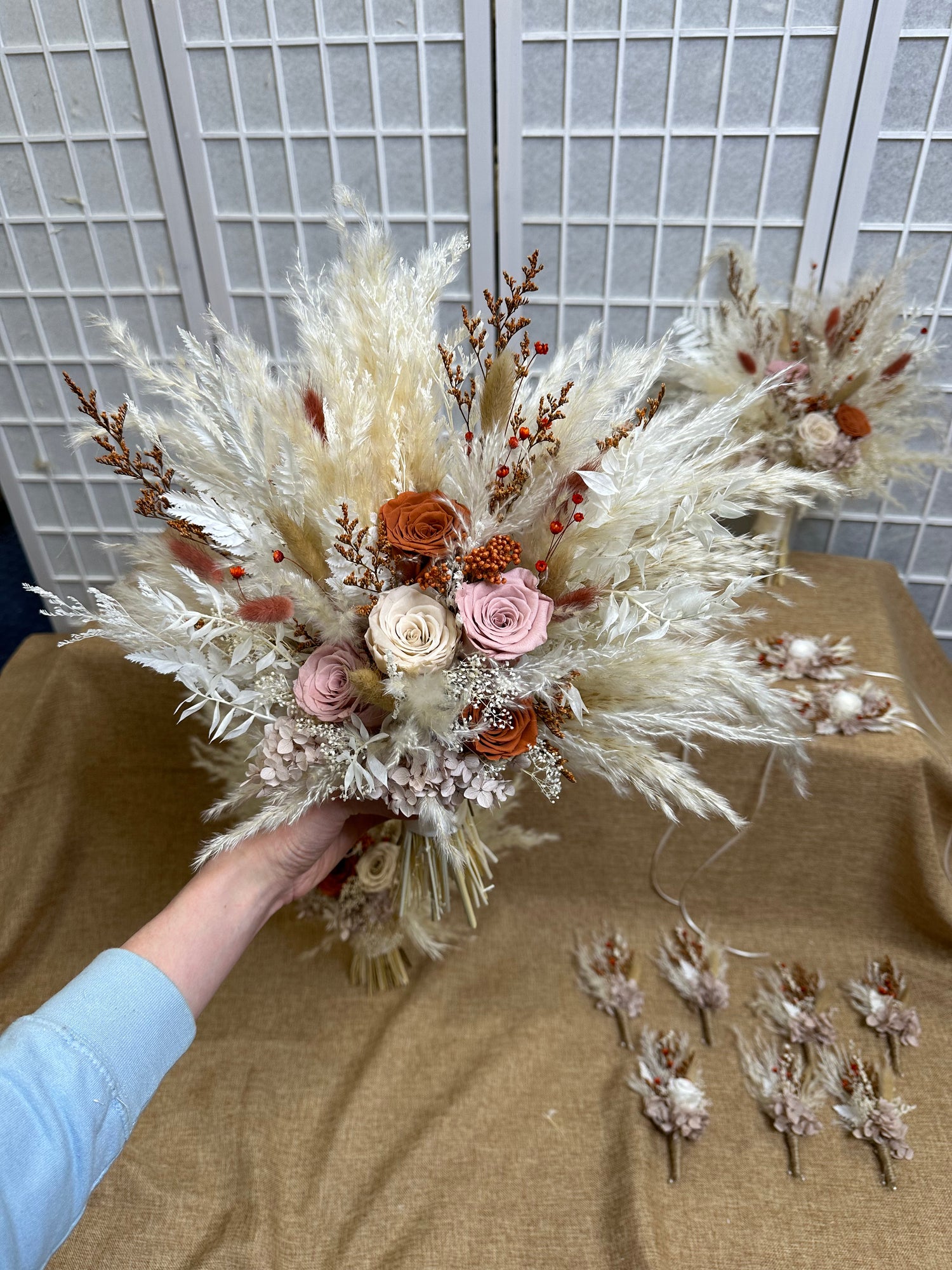 dried flower bridal bouquet with pampas grass and preserved roses